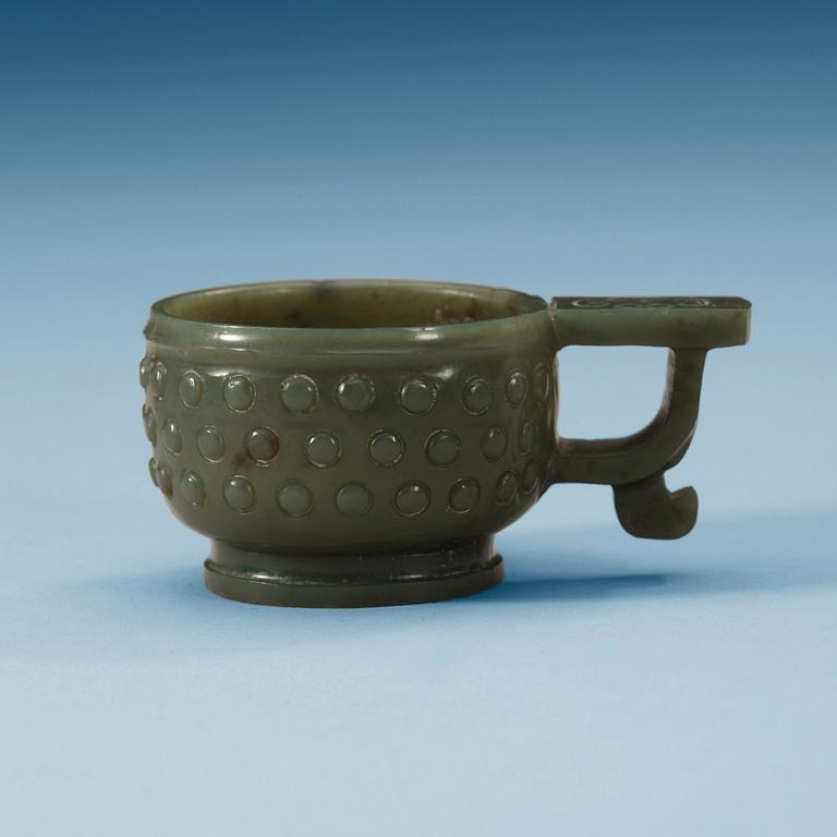 A Chinese archaistic carved nephrite cup.