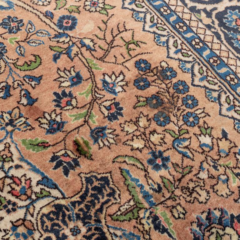 An oriental rug, circa 245 x 136 cm.