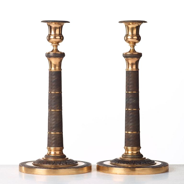 A pair of French Empire early 19th century candlesticks.