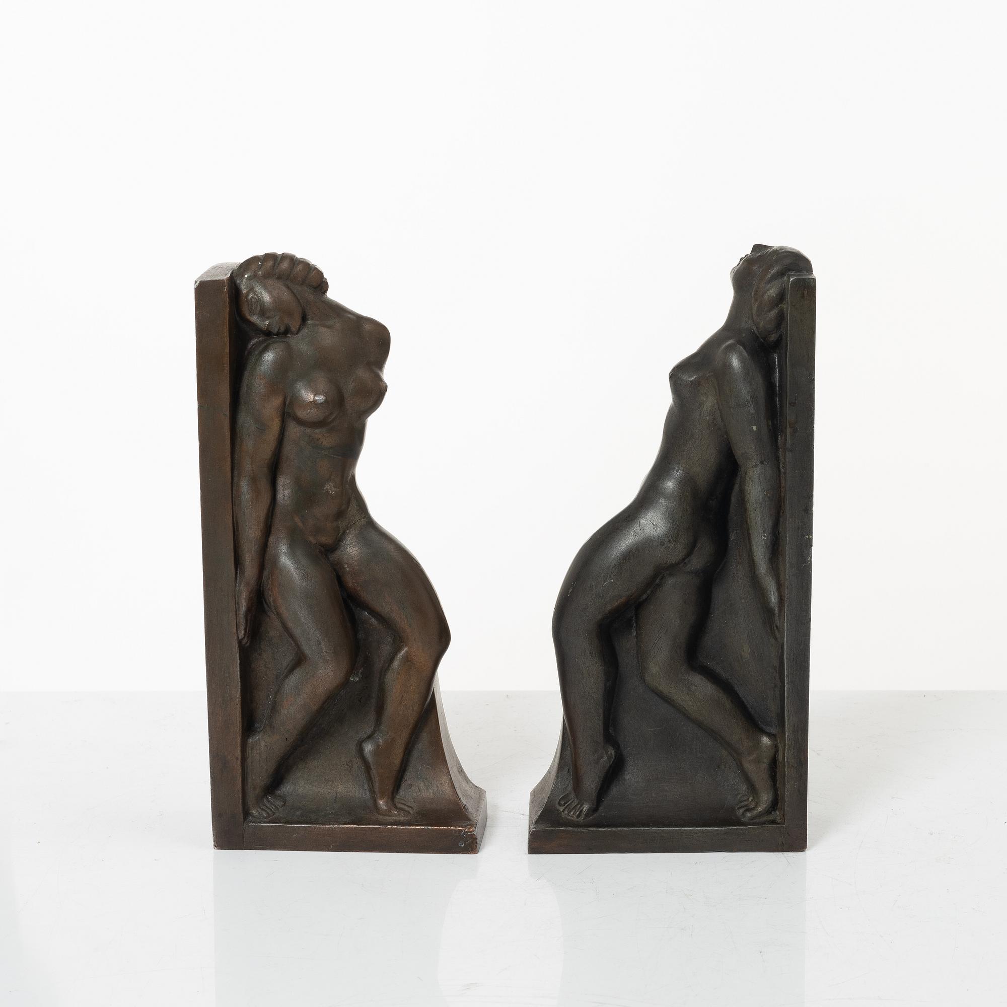Axel Gute, two patinated metal bookends.
