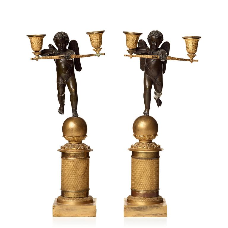 A pair of French Empire two-light candelabra.