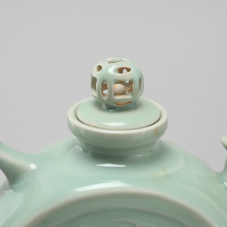 A celadon porcelain tea pot, China, modern manufactory.