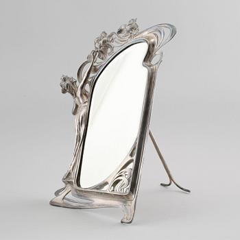 A jugend table mirror in electroplated nickel silver, made in the beginning of the 20th century.