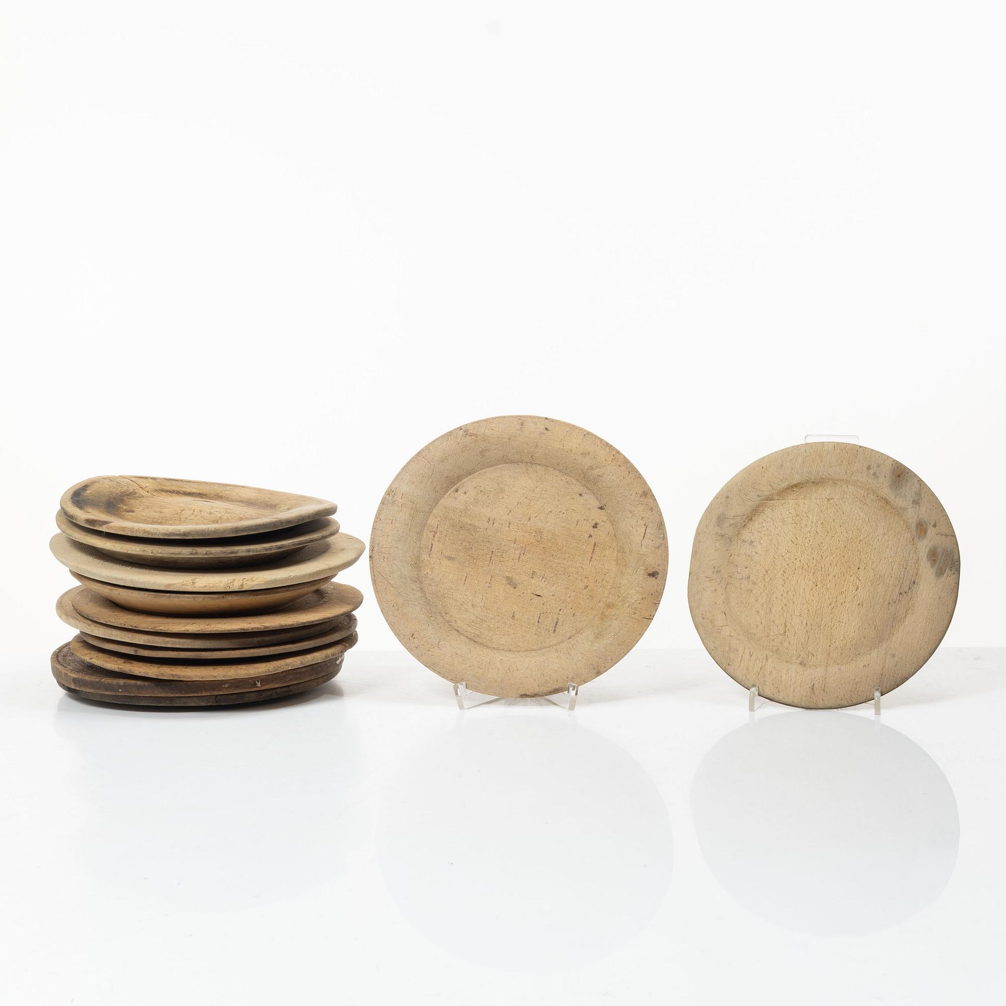 Twelve wooden plates, 19th Century.