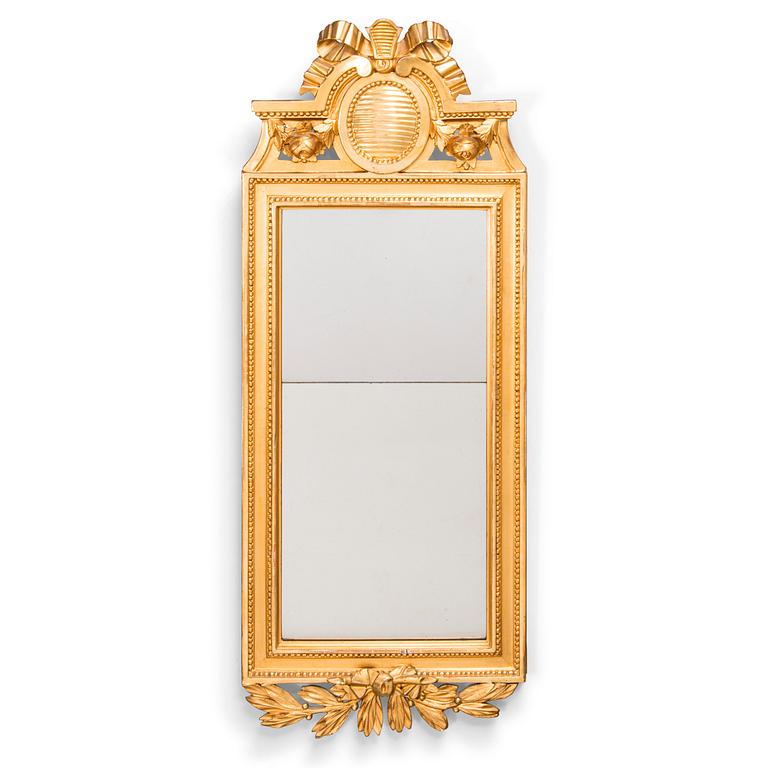 A Gustavian mirror signed Johan Åkerblad (master in Stockholm 1758 - 1799), dated 1785.