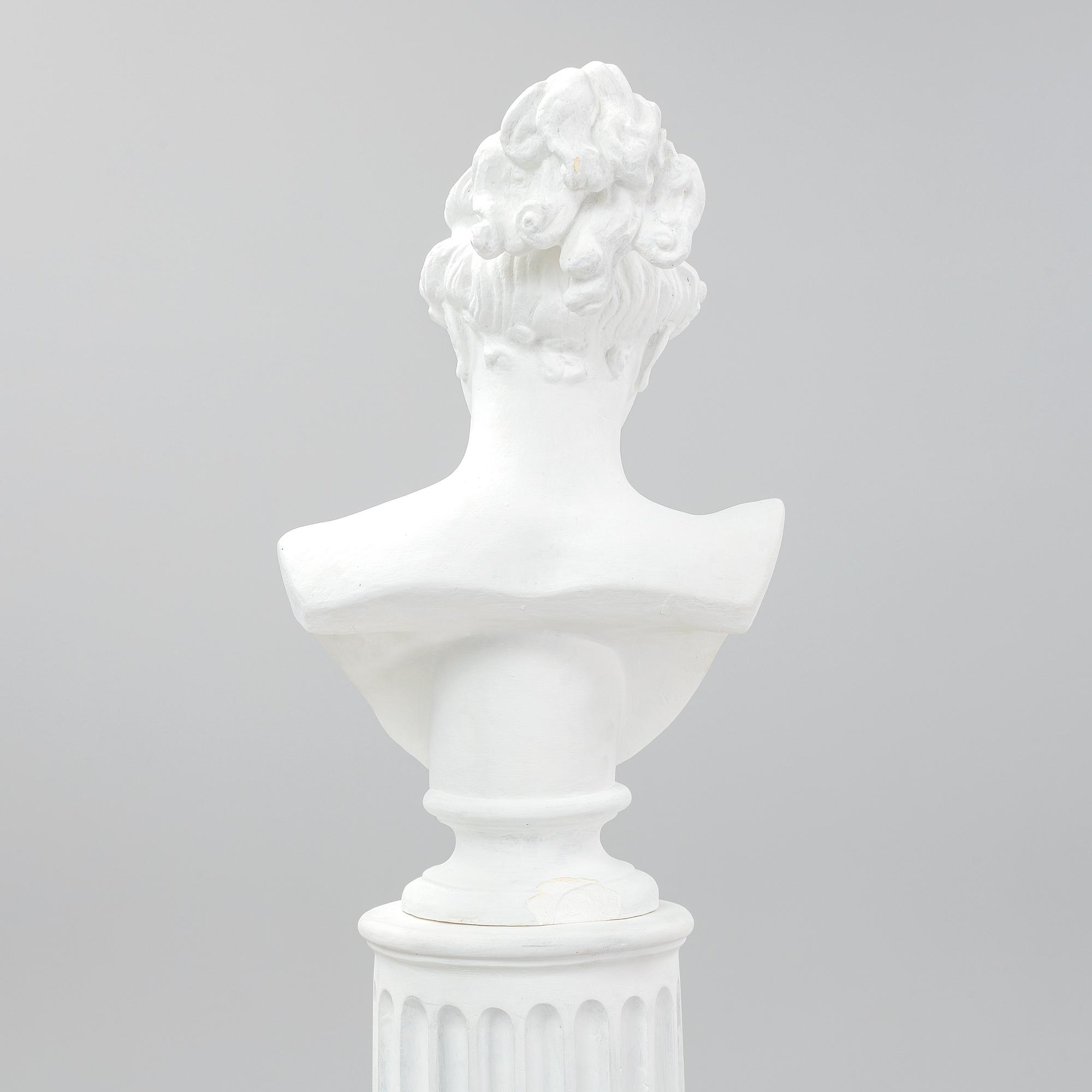 A plaster bust and pedestal.