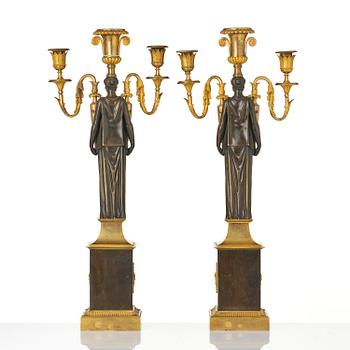 A pair of French Empire ormolu three-branch candelabra, Paris, early 19th century.
