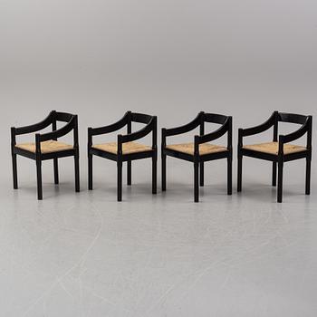 Vico Magestretti. Four black lacquered chairs with rope seats, "Carimate". Cassina, Italy.