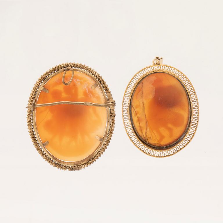 A pair of shell cameo pendants.