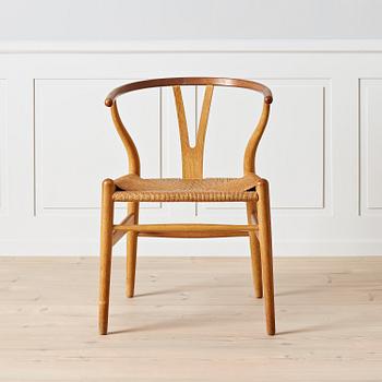 Hans J. Wegner, An early oak and teak 'Wishbone chair' by Carl Hansen & Son, Denmark, 1950's.