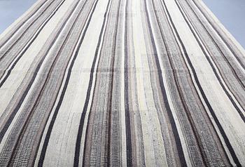A FLATWEAVE RUG, 338 x 240 cm.