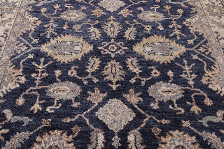 A Mamluk design carpet, c. 305 x 245 cm.