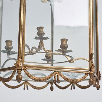 A Swedish rococo gilt-brass four-light lantern, possibly a masterpiece, Stockholm, later part of the 18th century.