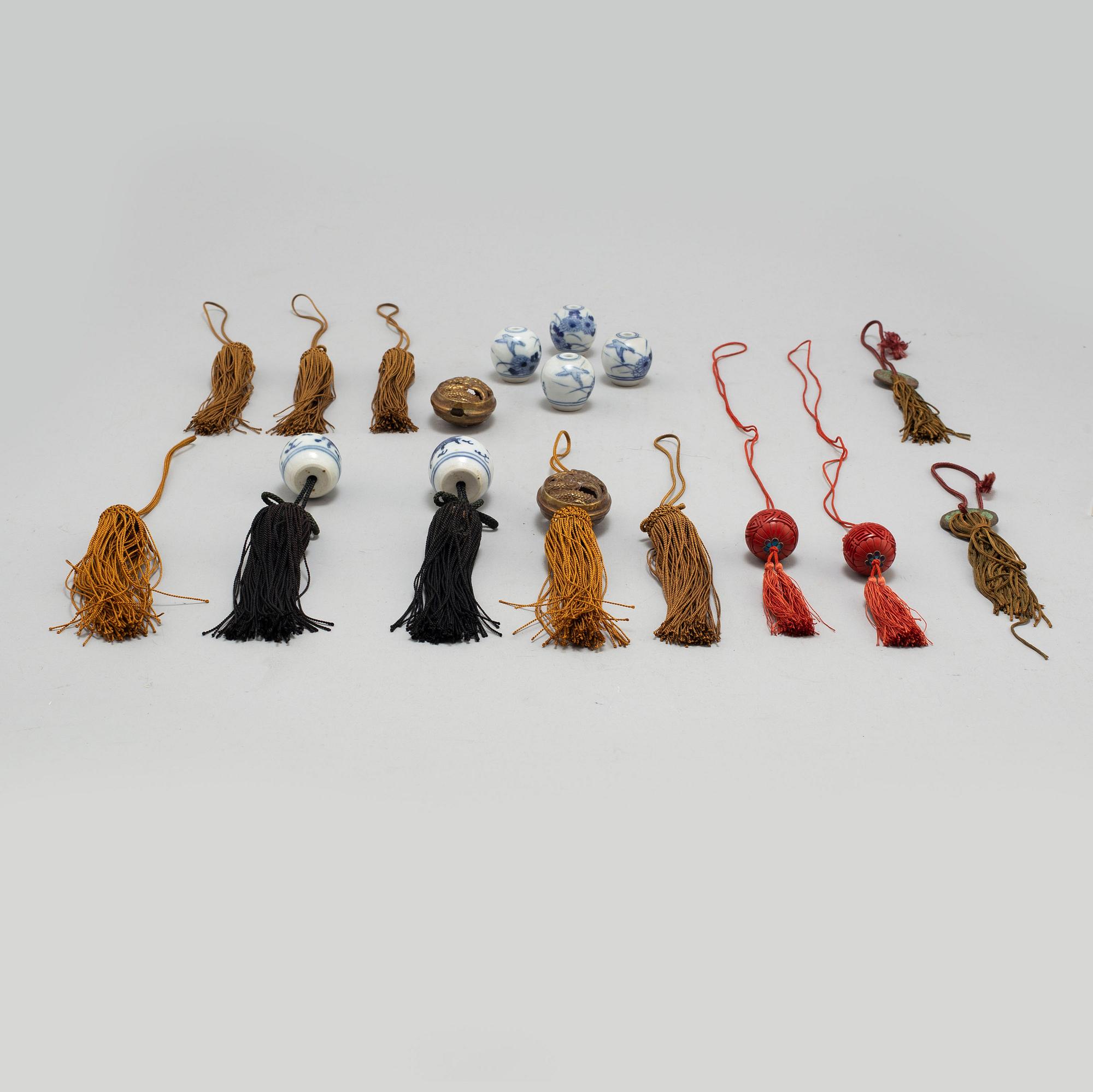Eight (6+2) tassles, porcelain and bronze, Japan, 20th century.