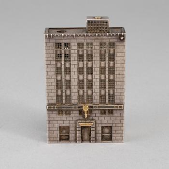 A Tiffany & Co. silver cigarette-lighter, marked London 1970.