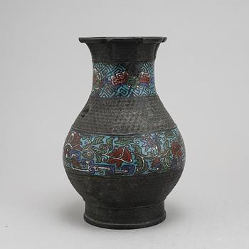 A Chinese bronze and cloisonné vase, around the year 1900.