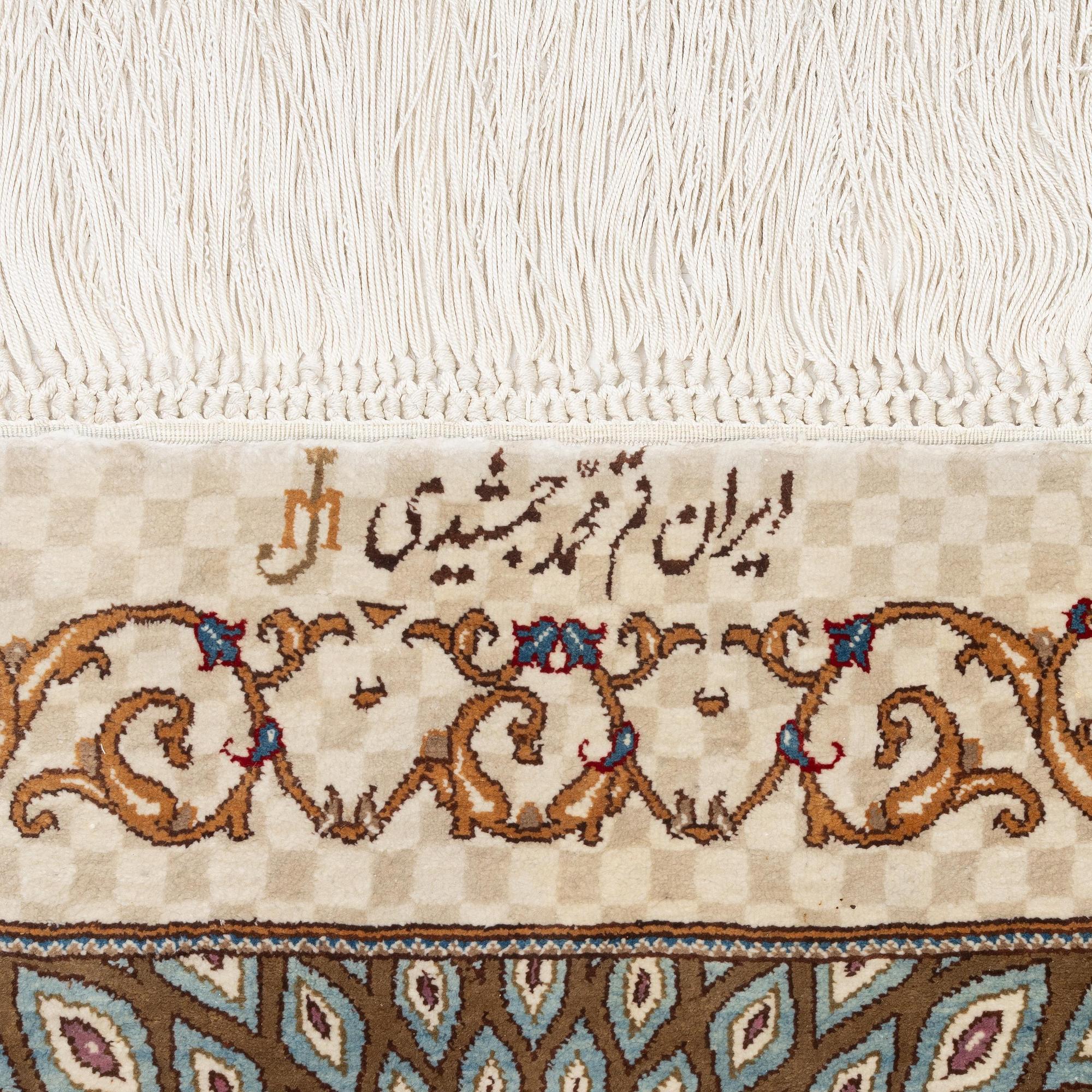 A silk Qum, Central Persia. signed Mohammad Gamshidi, c. 203 x 126 cm.
