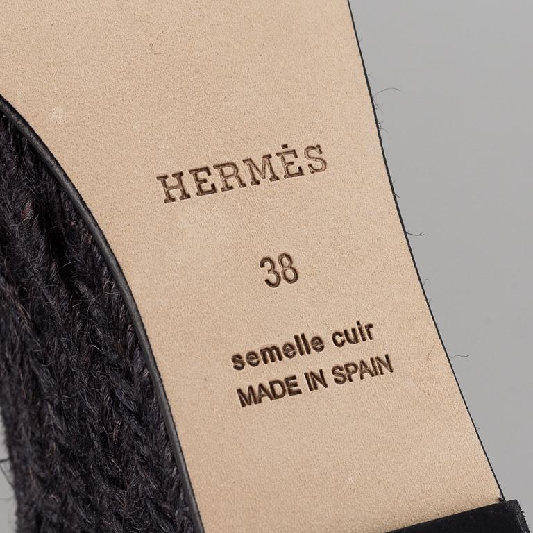 HERMÈS, a pair of black leather 'Tivoli' wedge sandals, 2019, size 38.