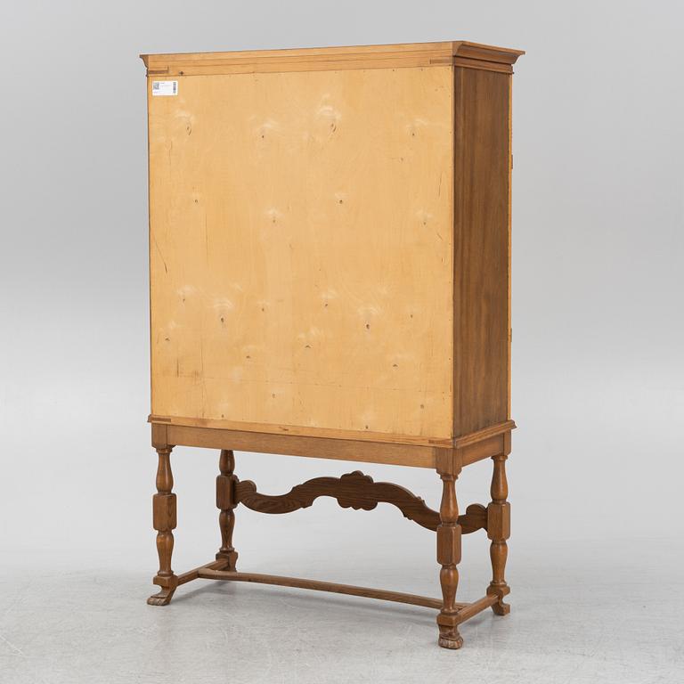 A leather, oak and mahogany cabinet, mid 20th Century.