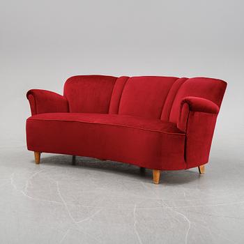 A first half of the 20th Century sofa with velvet upholstery.