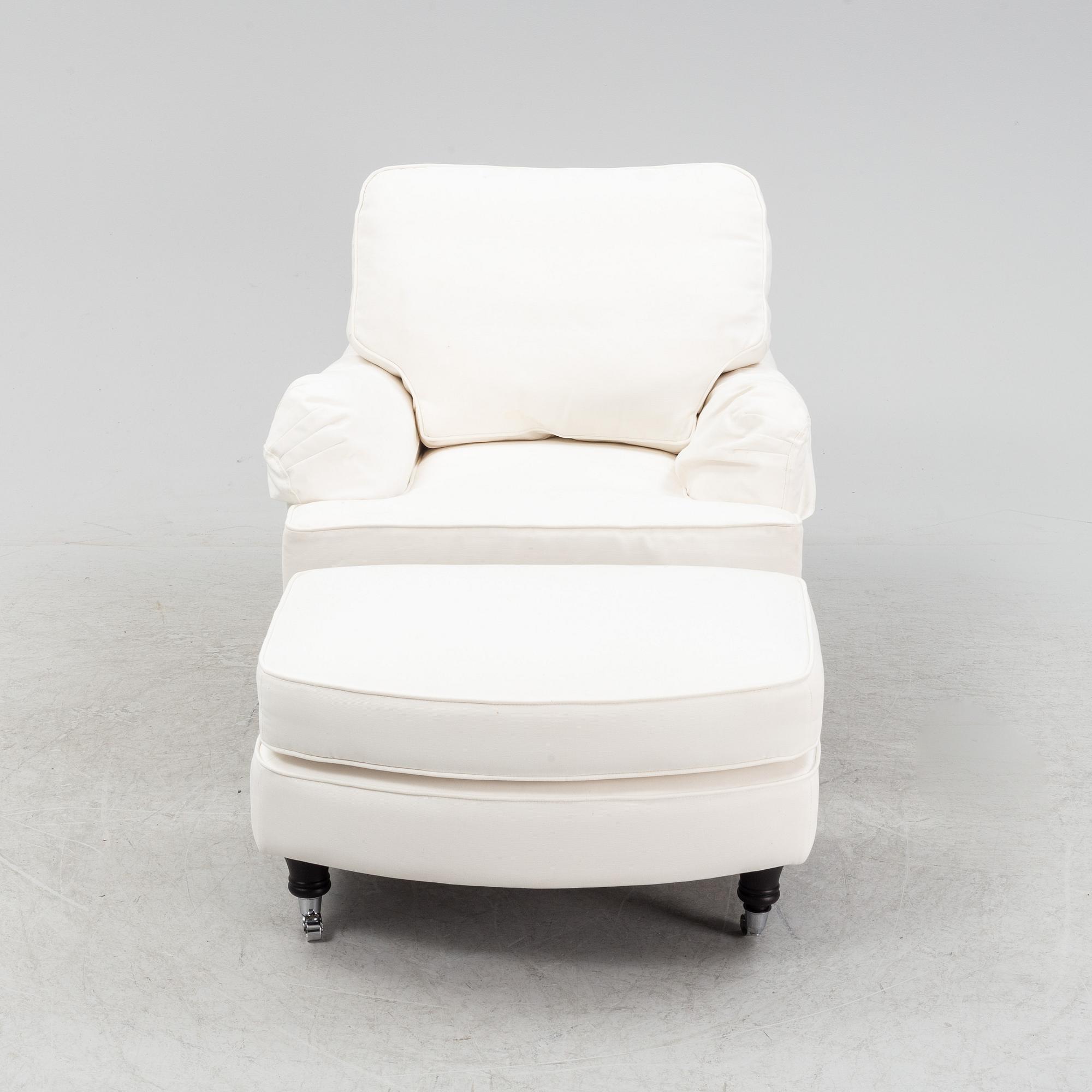 An easy chair with ottoman from Englesson, 21st century.