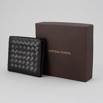 Bottega veneta, a black leather wallet.