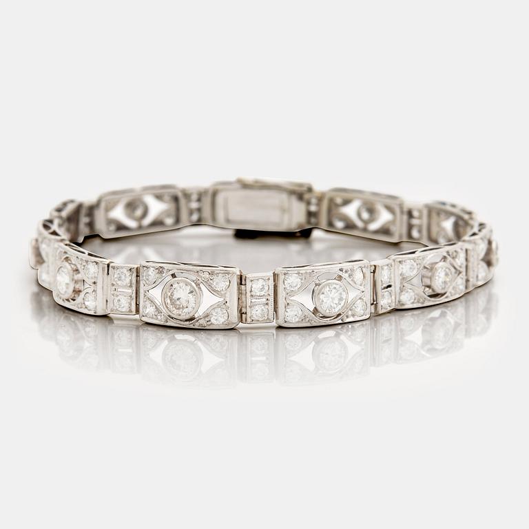 A bracelet set with old and eight cut diamonds.