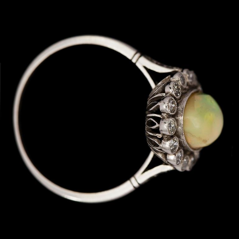 An opal, 1.25 cts and diamond ring.