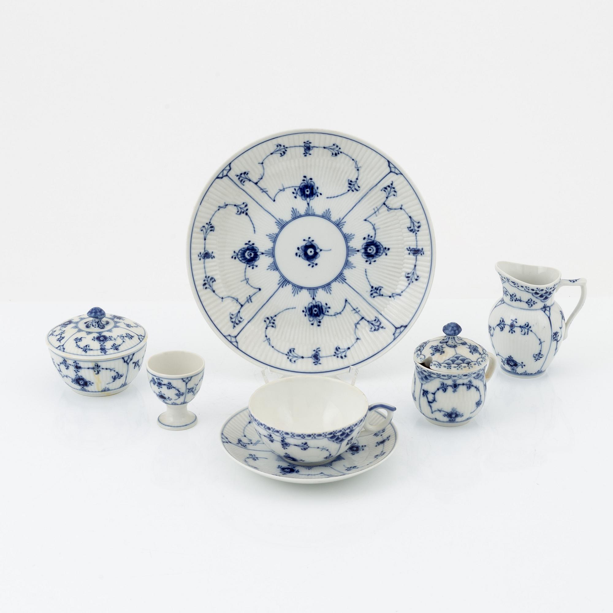 A 24-piece 'Musselmalet' tea service, Rifflet and half lace, Royal Copenhagen, Denmark.