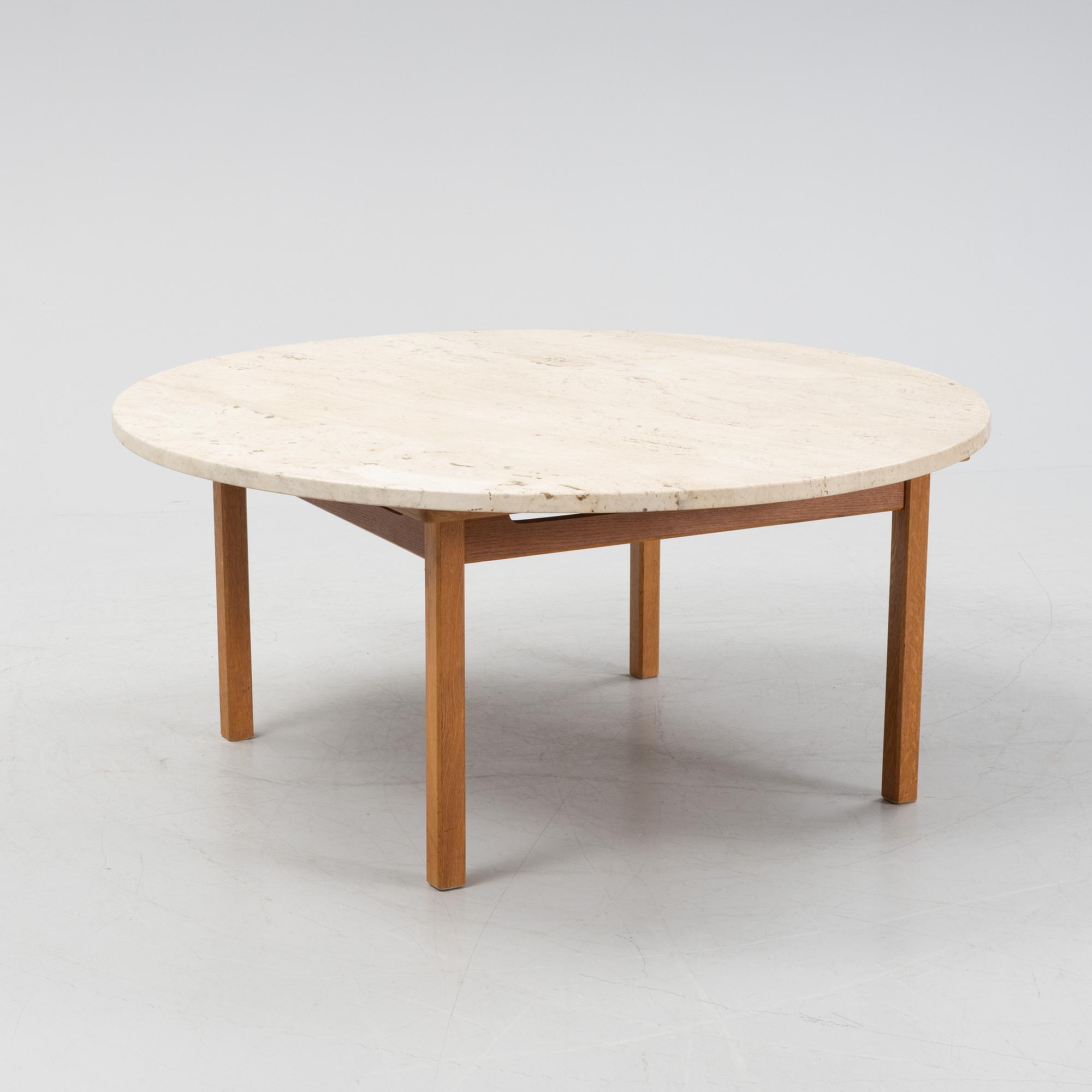 An oak coffee table with a later travertine top.