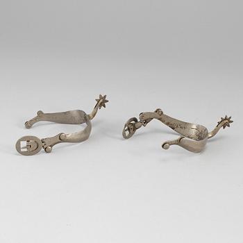 A pair of 19th century steel spurs.