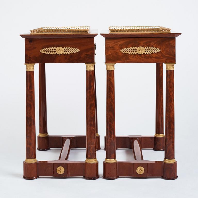 A pair of French Empire gilt bronze-mounted mahogany jardinieres, first half of the 19th century.