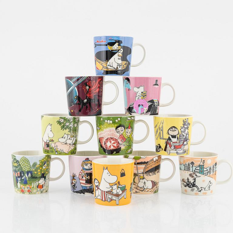 Eleven porcelain Moomin mugs, Arabia, Finland.