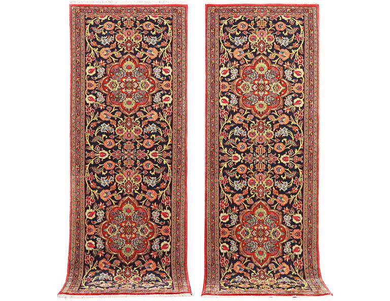 A pair of Quum rugs, c. 176 x 60 cm & c. 178 x 58 cm.