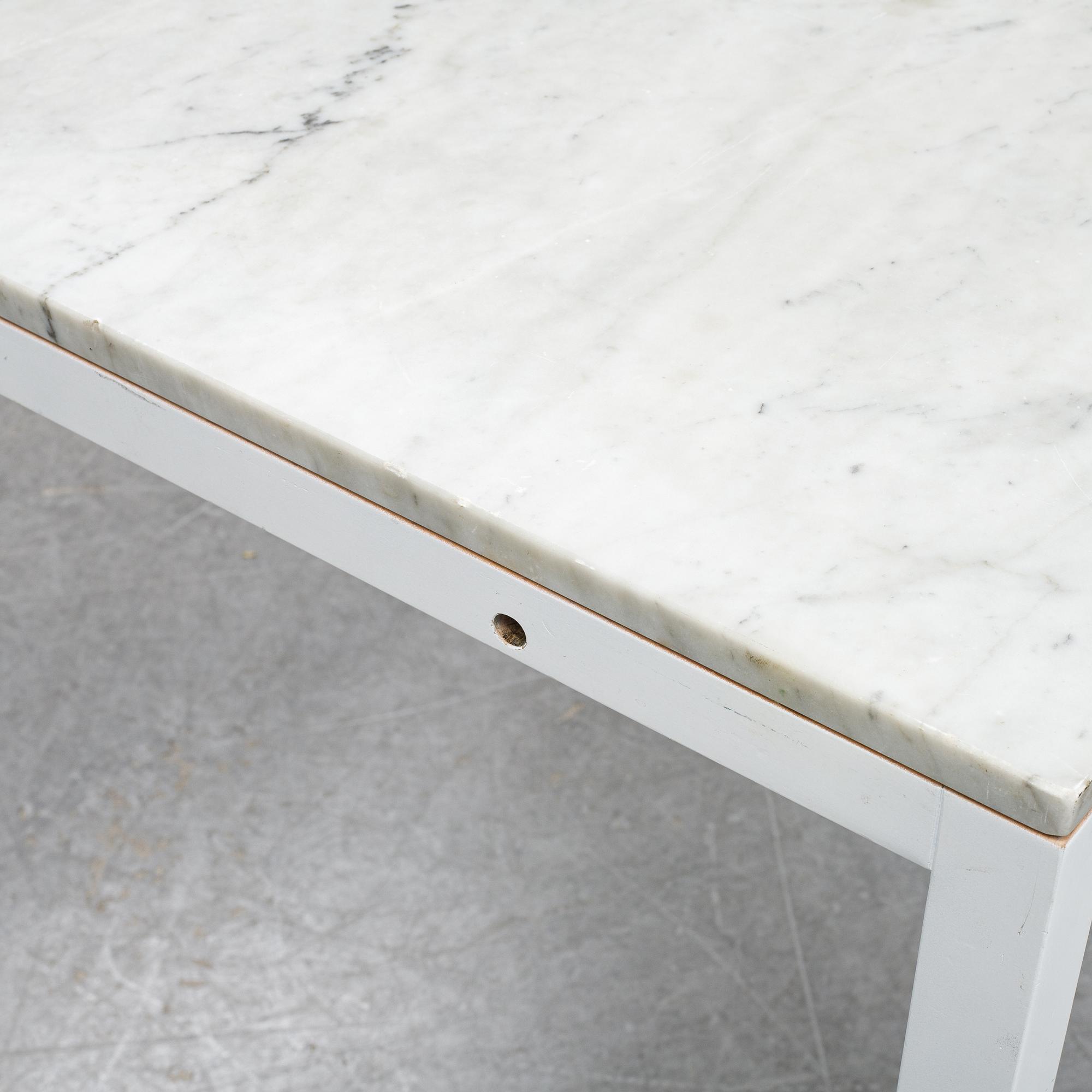 A marble top table, 21th century.