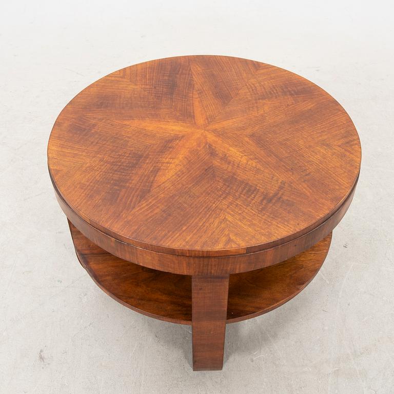 A stained wood table from the first half of the 20th century.