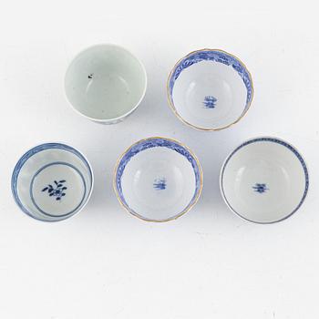 A group of thirteen cups, a bowl and a cup holder, four saucers, partly China and 18th century,