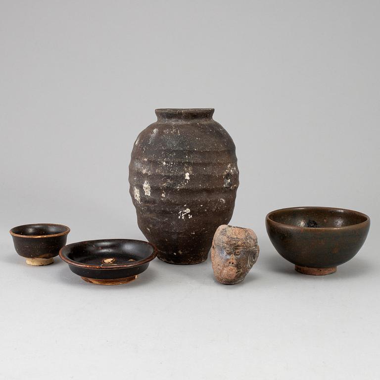 A group of five brown glazed South East Asian ceramics, 19/20th Century.