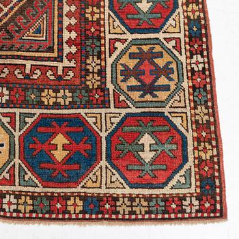 An antique Konya long rug, c. 324 x 144 cm.