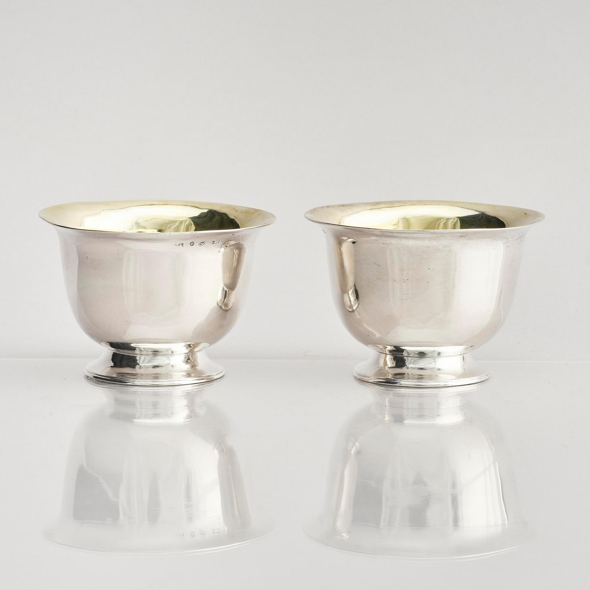 A pair of Swedish parcel-gilt silver dessert bowls with stand, mark of Gustaf Möllenborg, Stockholm 1830.