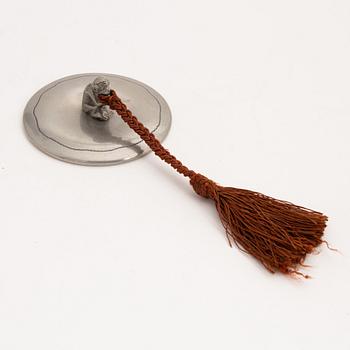 A 1930s hand held pewter mirror.