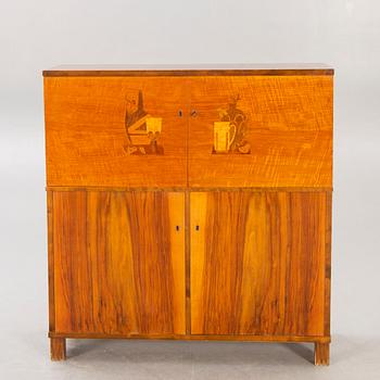 A 1930s birch bar cabinet.