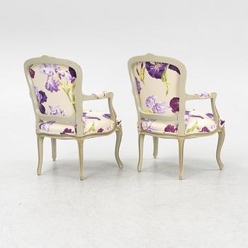 A pair of rococo style armchairs, 20th Century.