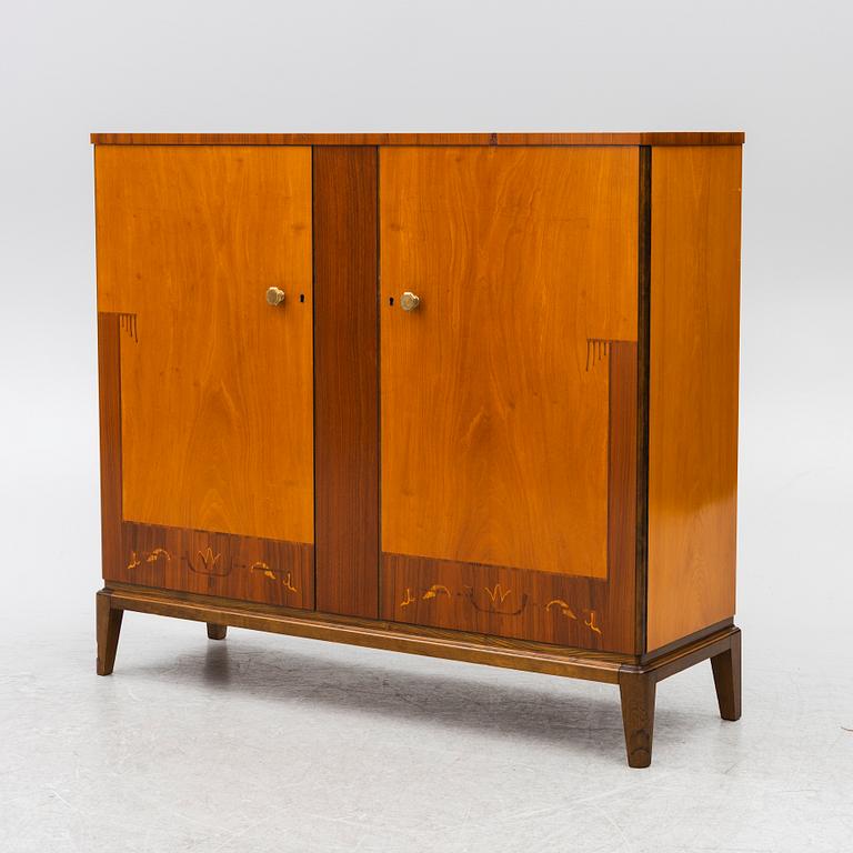 A Swedish Modern cabinet, mid20th century.