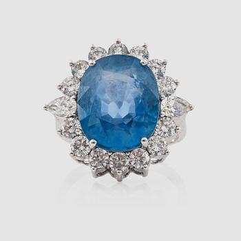 1371. A pale blue natural untreated sapphire, 13.16 cts, and 1.95 ct brilliant-cut diamond ring.