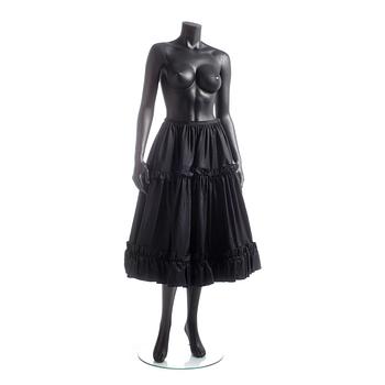 YVES SAINT LAURENT, a black silk skirt.