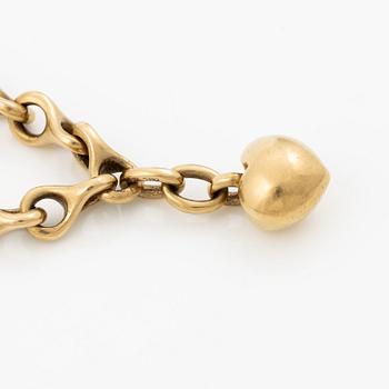 An Ole Lynggaard bracelet 18K gold with heart charm.