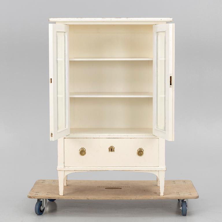 A display cabinet, early 20th century.