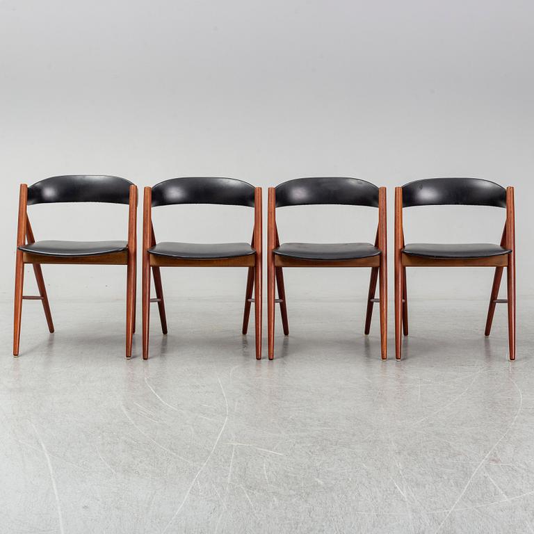 Four 1960s teak chairs.