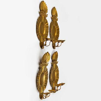 A set of four baroque style brass wall sconces, probably 1950s.
